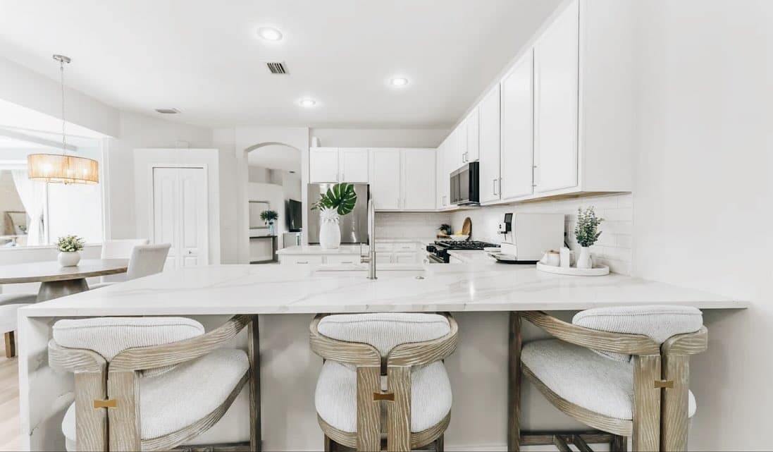 Custom kitchen countertop installation with modern white finish